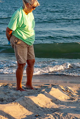 Volunteer observes a straggler make it to the ocean.